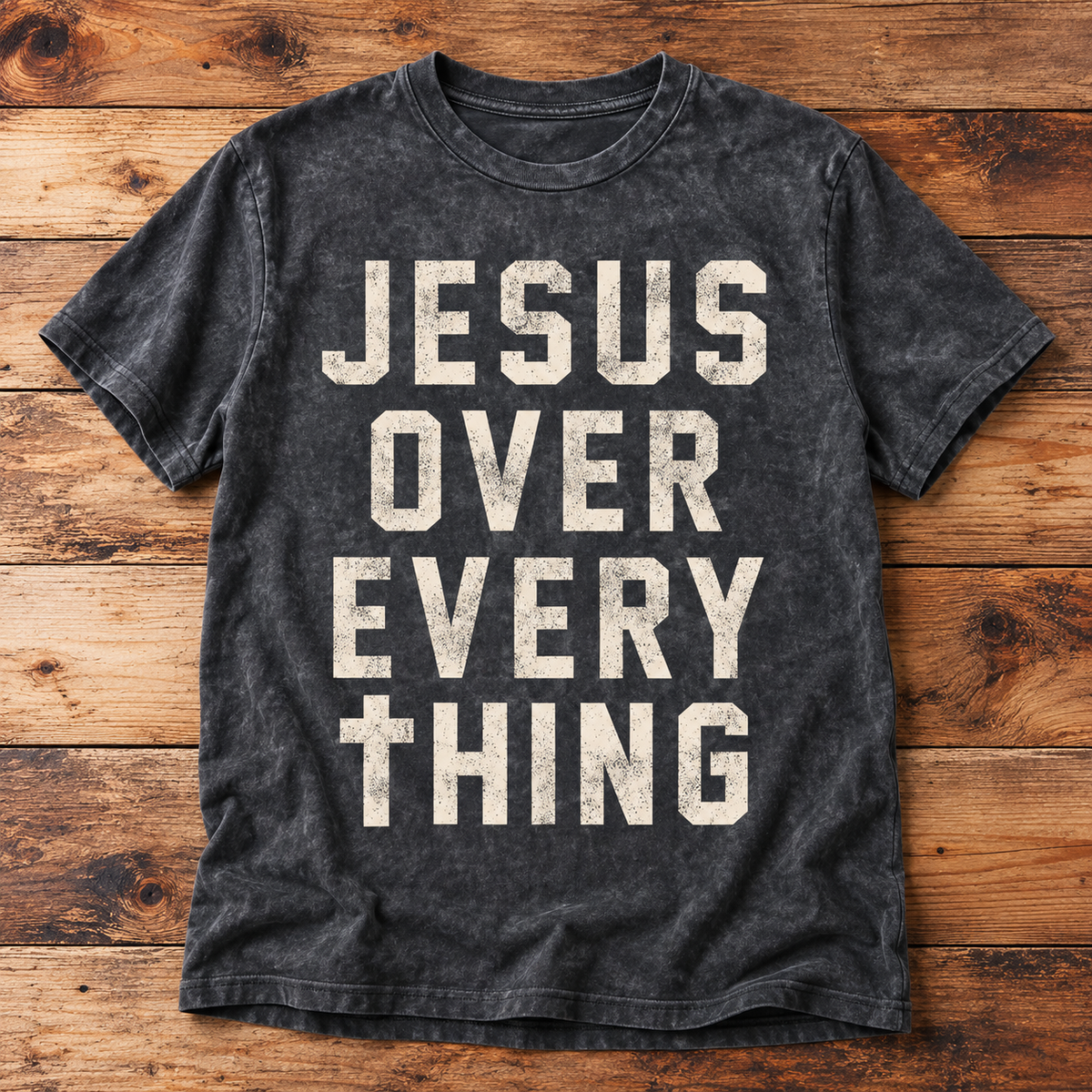 Charcoal mineral-washed Jesus Over Everything T-shirt with distressed cream lettering.