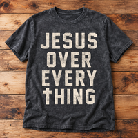 Charcoal mineral-washed Jesus Over Everything T-shirt with distressed cream lettering.